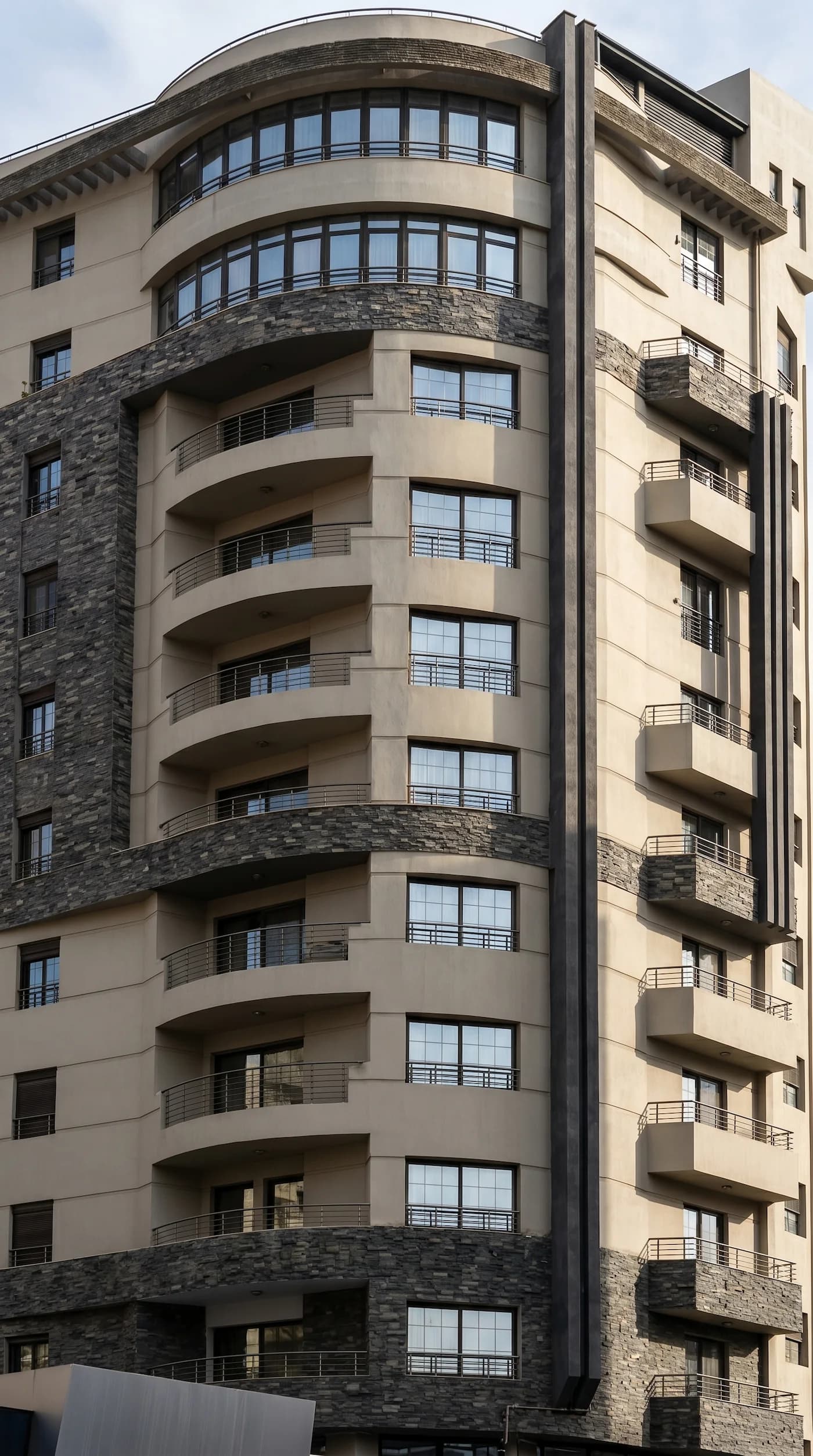 Heritage Bigavita façade with stonework and curved balconies