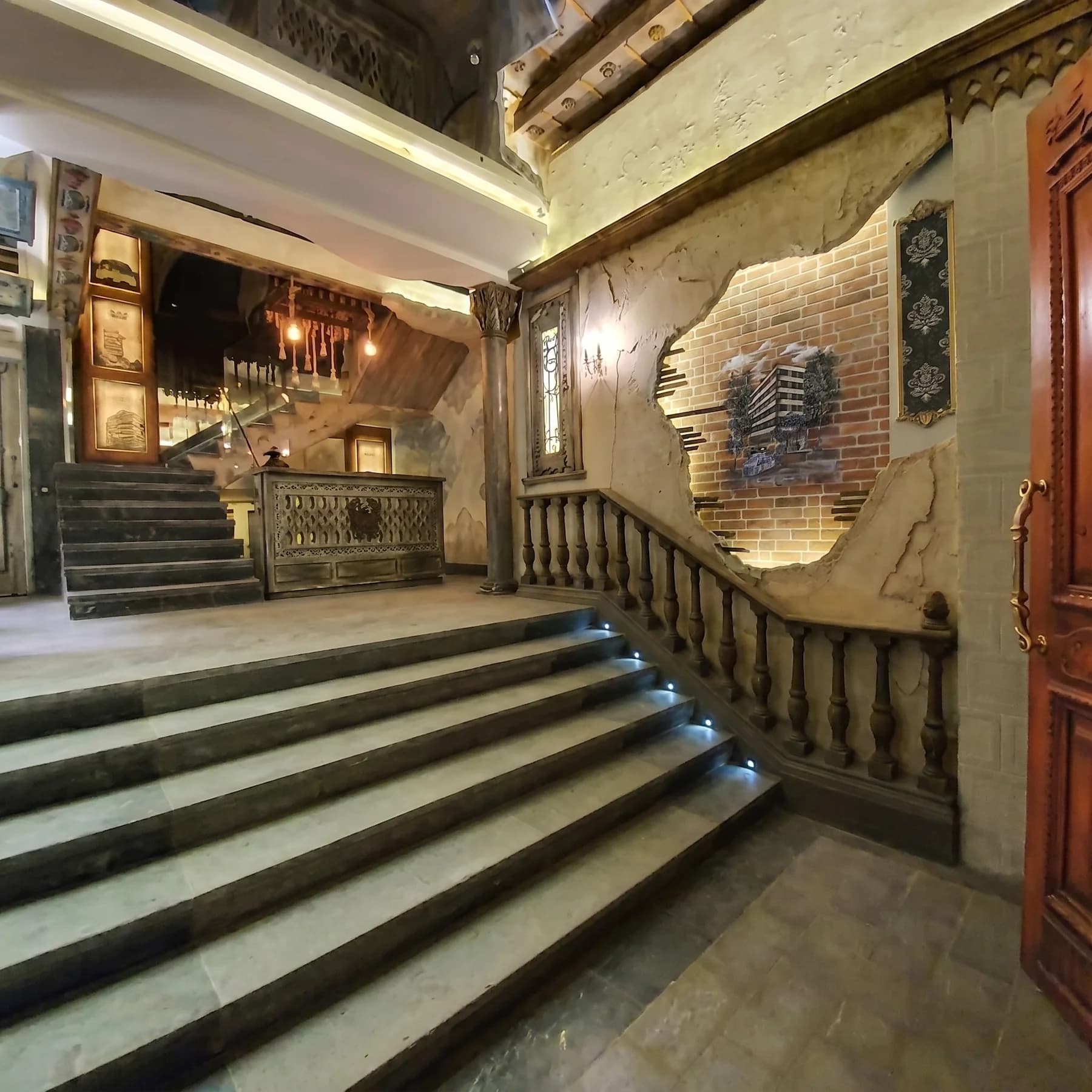 Wide interior view of Heritage Legend lobby and staircase